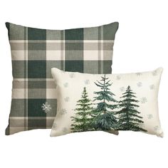 two pillows with trees on them and snowflakes in the background, one is green