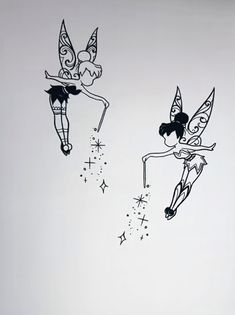 two tinkerbells flying in the sky with stars on their backs and tails