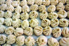 some dumplings are sitting on a table together