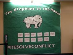 the elephant in the room poster is displayed on a wall with information about its surroundings