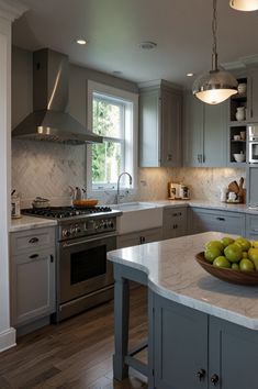 a bowl of fruit sitting on top of a kitchen counter