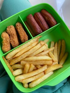 a green tray filled with different types of food