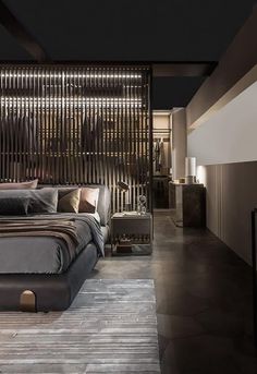 a large bed sitting in the middle of a bedroom next to a wall with wooden slats