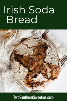 irish soda bread on a white plate next to a glass of beer and napkins