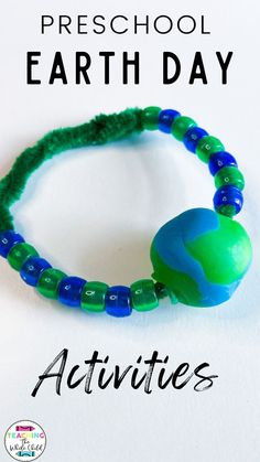 a green beaded bracelet with the words preschool earth day activities