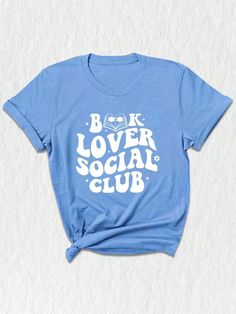 Introducing our exclusive Social Club Bookish T-Shirt, a must-have for all bookworms and avid readers! ✨ Perfect for book club enthusiasts and lovers of literature, this unique design merges style and intellect to create a statement piece for any occasion. Our social club shirt features a captivating illustration that brings together various elements of the bookish world.  The center focuses on a charming library, adorned with piles of books and a cozy reading chair. Surrounding it, adorable emojis depict the joy of reading, expressing your love for books without saying a word! ❤️ For those who are passionate about banned books or appreciate literary rebellions, this shirt showcases a subtle nod with a red "BANNED" stamp, adding an extra edge to your wardrobe.  Designed with comfort in min Bookish Tees, Cozy Reading Chair, Book Club Shirt, Bookworm Shirt, Librarian Shirt, Happy Shirt, Trendy Beach, Reading Shirts, Reading Chair