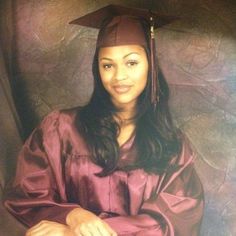 a woman wearing a graduation cap and gown