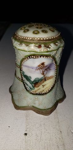 a porcelain box sitting on top of a table