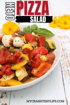 a white bowl filled with pizza salad on top of a table