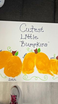 a child's drawing of three little pumpkins with the words cutest little pumpkins written on it