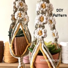 two crocheted pot holders with plants in them