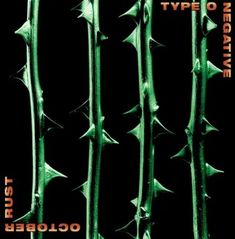 the cover art for an upcoming album, featuring green spikes and black background with orange lettering