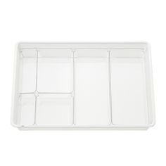 a white plastic tray with compartments on it