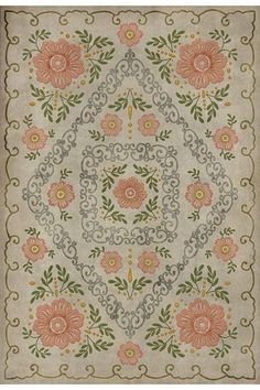 an old rug with flowers and leaves on the bottom, in pastel pinks