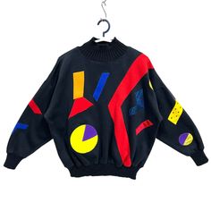 "Vintage Multicolor Patch Ribbed High Neck Sweater Art Sweatshirt Pullover Black Small Medium * Used. In good condition (7/10) minor signs of wear (view photos) * Tagged unknown (missing tag). May fit women small to medium. Flat laid measurements in inches (appox) - Chest (underarm to underarm) : 24\" - Length (side of neck seam to bottom hem) : 23.5\" - Sleeve (neckline to cuff) : 26\" BUY 3 ITEMS GET FREE SHIPPING WORLDWIDE ATTENTION : PLEASE READ * SHIPPING via PREMIUM EXPRESS. Delivery about 5 business days to major cities / towns. * SOME REMOTE AREA delivery takes longer. Usually within two weeks after shipped out." Vintage Black Sweatshirt For Winter, 90s Black Sweatshirt For Fall, 90s Style Black Sweater For Fall, 90s Black Sweater For Fall, Retro Black Crew Neck Sweatshirt, Retro Graphic Print Sweatshirt For Winter, Black Retro Crew Neck Sweatshirt, Black Vintage Sweater For Streetwear, 90s Black Sweater For Streetwear