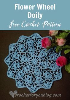 a crochet doily with flowers on it and the words, flower wheel doily free crochet pattern