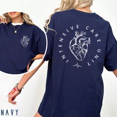 This ICU Nurse Shirt / Intensive Care Unit Shirt is perfect for the Intensive Care Nurse or anyone who works in the ICU. **FRONT & BACK PRINT**  **UNISEX SIZING**  Click here to return to our shop's home page ⇒  https://www.etsy.com/shop/SketchyCatDesigns ♥ W E L C O M E  T O  S K E T C H Y  C A T  D E S I G N S ! ♥ All of our products are printed with eco-friendly water-based inks, giving them the softest feel. The design itself is embedded into the fabric so that your shirt is cozy and comfy a Blue Short Sleeve Tops With Heart Graphic, Short Sleeve Cotton Nursing Tops, Relaxed Fit Nursing Tops With Crew Neck, Cotton Short Sleeve Nursing Tops, Cotton Nursing Tops With Short Sleeves, Casual Nursing Tops With Relaxed Fit, Relaxed Fit Nursing Top With Short Sleeves, Cotton Relaxed Fit Top For Nursing, Nursing Graphic Tee Cotton Top