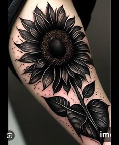 a black and white sunflower tattoo on the arm