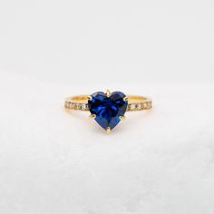 Sapphire heart ring set with a Created Sapphire in a heart cut and deep blue color, 8x8mm, 2 Cts with created CZ diamonds at 1mm each. Made of Solid 925 Sterling Silver & 18k Gold Vermeil coating ☞ made to last. *Sizes 12-16 U.S. are custom-made (additional cost), I will contact you directly with all the info when a custom made size is ordered. Details : ♥ Created Sapphire in a flawless heart cut and clarity ✓ ♥ Created Diamond in the pave band - flawless cut and clarity ✓ ♥ Pure Solid 925 Sterl Trillion Cut Blue Sapphire Ring For Gift, Sapphire Rings With Heart Cut And Accent Stones, Sapphire Heart Cut Rings With Accent Stones, Elegant Blue Heart-shaped Sapphire Ring, Blue Heart-shaped Sapphire Ring For Anniversary, Blue Trillion Cut Rings For Gift, Heart-shaped Sapphire Ring For Anniversary, Heart-shaped Lab-created Sapphire Jewelry For Valentine's Day, Elegant Blue Heart Ring For Valentine's Day