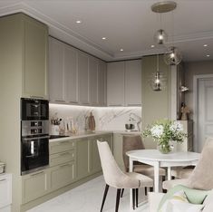 a kitchen and dining area with white table and chairs, light green cabinets and marble countertops