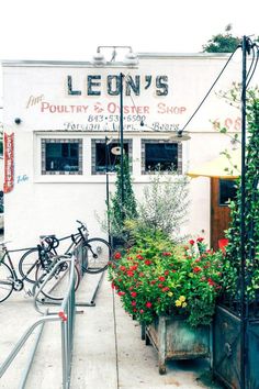 the front of leon's potted planter shop with bicycles parked outside it