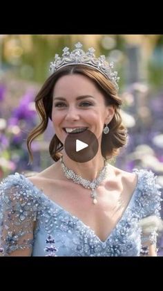 a woman wearing a tiara and smiling at the camera with purple flowers in the background