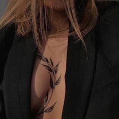 a woman with a tattoo on her chest