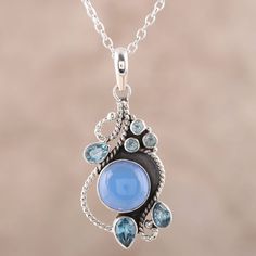 A round blue chalcedony is accompanied by over one carat of petite blue topaz stones in this necklace. From Shanker, the pendant is crafted by hand, framing the stones with graceful sterling silver rope motifs. Blue Topaz Pendant Necklace, Key Pendant Necklace, Blue Topaz Pendant, Topaz Pendant, Topaz Color, Blue Topaz Stone, Classy Jewelry, White Gold Necklaces, Topaz Stone