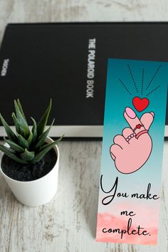 a card that says you make me complete next to a succulent potted plant