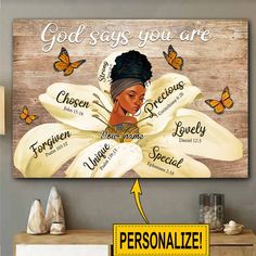 a wooden sign with the words god says you are surrounded by yellow flowers and butterflies