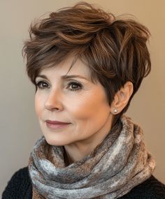 Rounded pixie cut for women over 50, offering a soft and feminine look Shaggy Pixie Cuts, Tousled Bob, Wavy Lob, Curly Pixie Cuts, 50 Hair, Chin Length Bob, Asymmetrical Bob, Hairstyles For Women Over 50, Curly Pixie