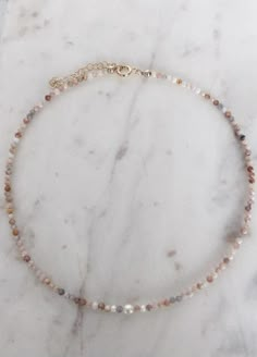 This pretty choker necklace is hand made with 14k gold filled beads, semi precious gemstones and mini pearls. Perfect on its own for a simple look or layered with your favs. DETAILS + CARE: Length: 15 inches AVAILABLE IN: ﻿All 14k Gold Filled with mini pearls Pink Moonstone with mini pearls Black Spinel with mini pearls All pearls with 14k gold filled beads Pretty Choker Necklace, Diy Wire Jewelry Rings, Jewlery Necklace, Wire Jewelry Rings, Pink Moonstone, Beads Craft Jewelry, Gemstone Choker, Beaded Necklace Designs, Black Choker Necklace