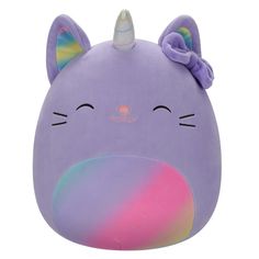 a purple stuffed animal with a unicorn horn on top of it's head and eyes