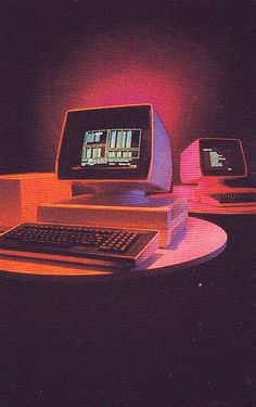 an old computer with two monitors and a keyboard