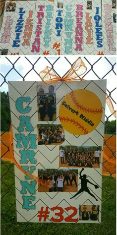 a baseball themed sign is hanging on a chain link fence in front of a field