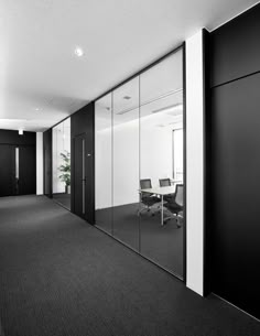 an empty office with black and white walls