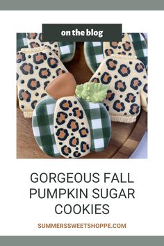 some cookies with leopard print on them and the words, gorgeous fall pumpkin sugar cookies