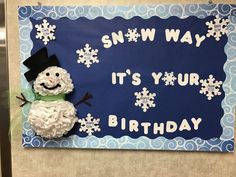 a snowman made out of toilet paper sitting on top of a sign