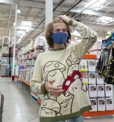 a woman wearing a face mask in a store