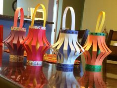 colorful paper lanterns sitting on top of a table