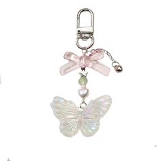 a keychain with a butterfly and pearls on the bottom, attached to a chain