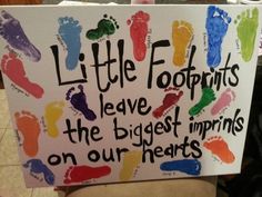 a sign that says little footprints leave the biggest imprints on our heart's