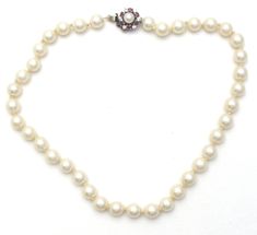 Vintage Fashion Jewelry - This is a strand of hand knotted creamy white glass pearls with a sterling silver clasp. The necklace is 15" long, pearls are 8mm wide, slide in locking clasp has ruby red and clear crystals with side safety clip. Classic 8mm Bead Pearl Necklace For Formal Occasions, Classic Formal Pearl Necklace With 8mm Beads, Adjustable Beaded Necklaces For Formal Occasions, Formal White Jewelry With 8mm Beads, Classic Pearl Necklace With Lobster Clasp And Round Beads, Classic Pearl Necklace With Lobster Clasp, Classic Single Strand Beaded Necklaces For Formal Occasions, Classic Single Strand Beaded Necklace For Formal Occasions, Formal Pearl Necklace With 8mm Beads