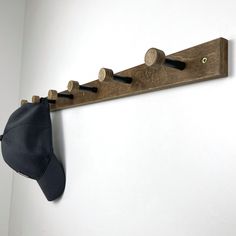 a hat is hanging on a coat rack