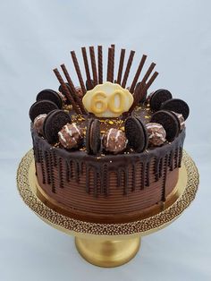 a chocolate cake topped with cookies and oreos