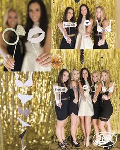 a group of women standing next to each other in front of a gold wall with paper decorations