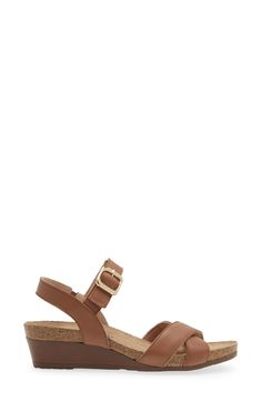 A gleaming buckle stands out against the supple leather straps on this open-toe sandal set on a low wedge for comfortable height. 1 3/4" heel (size 39) Adjustable ankle strap with buckle closure Cushioned footbed with arch support Leather upper and lining/synthetic sole Brown Leather Low Heel Wedge Sandals, Brown Low Heel Slingback Sandals With Buckle, Leather Sandals With Cork-bed Midsoles And Low Heel, Leather Sandals With Low Heel And Cork-bed Midsoles, Leather Low Heel Wedge Sandals With Buckle Closure, Low Heel Leather Wedge Sandals With Buckle, Brown Leather Wedge Heel Footbed Sandals, Low Wedges, Open Toe Sandals