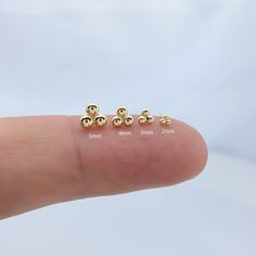 Introducing our elegant 14K gold Dot Stud Earrings, specially designed for cartilage  piercings. These exquisite studs feature a convenient push-back closure, ensuring  both comfort and security Material 14K Yellow Gold + Implant Grade Titanium Push Back Guaranteed to be genuine 14K solid gold, not plated or filled Closing method: push-back type Size: 3.5mm.5mm.7mm ★★This item is for ONE piece, NOT one pair ★★ ★★Wearable on Cartilage, Helix, Earlobes, Inner Conch or Nose★★  SHIPPING ADDRESS ●All Dainty Gold Cartilage Earring, Dainty Gold Single Cartilage Earring, Dainty Gold Hypoallergenic Cartilage Earrings, Dainty Hypoallergenic Gold Cartilage Earrings, Gold Minimalist Tarnish-resistant Cartilage Earrings, Dainty Hypoallergenic Yellow Gold Nose Stud, Dainty 14k Gold-filled Piercings, Tiny Yellow Gold Minimalist Piercings, Tiny Minimalist Yellow Gold Piercings