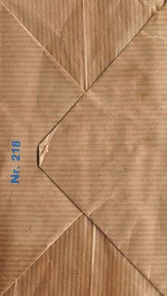 a piece of brown paper with blue numbers on it