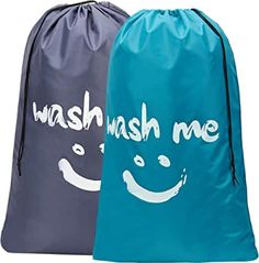 two drawsacks with the words wash me and smile face on them, both in grey and blue